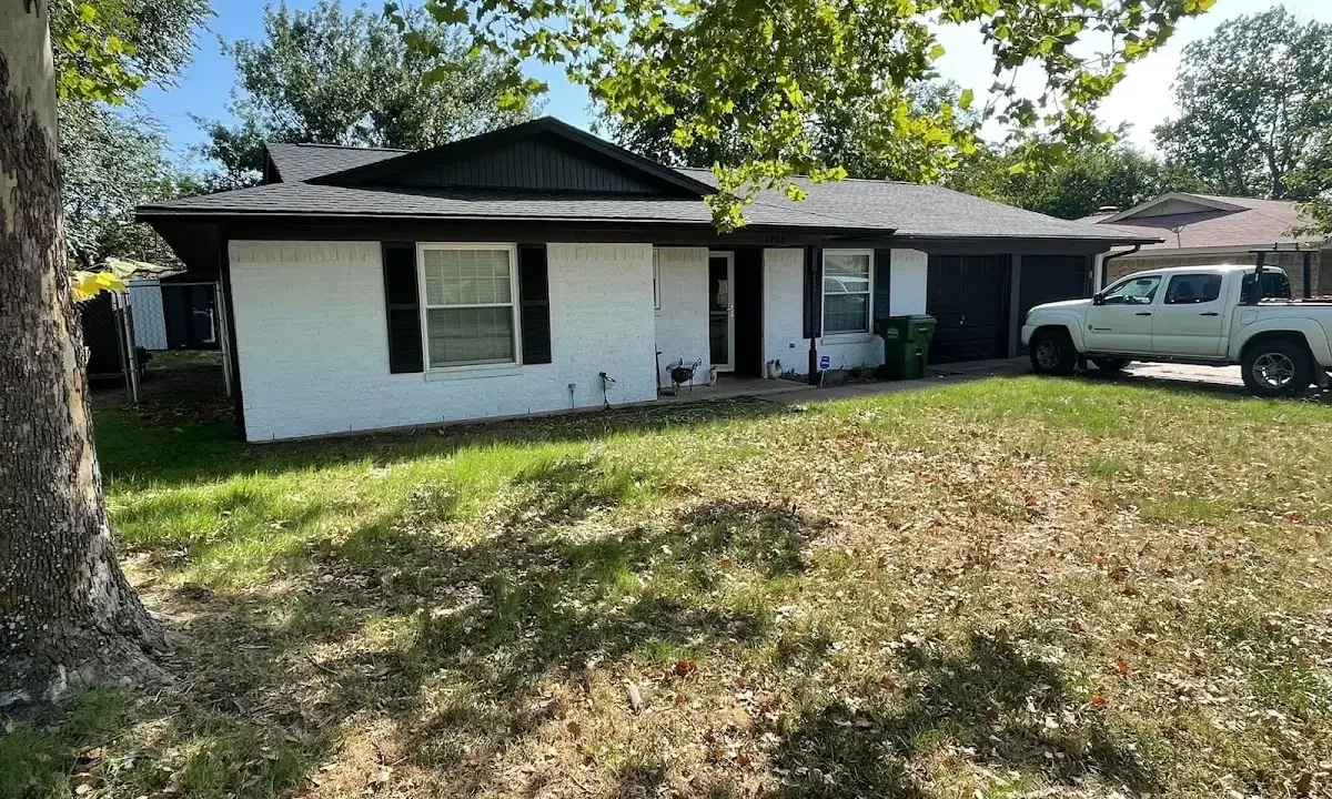 Professional roofing crew working on a residential roof in Mayo